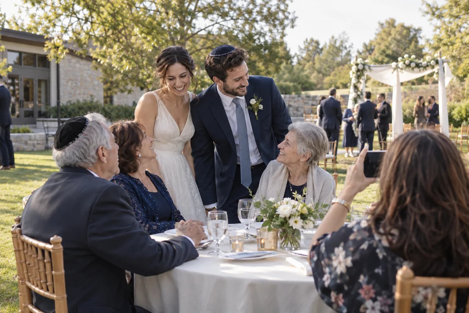 A couple and their families celebrating a Jewish wedding