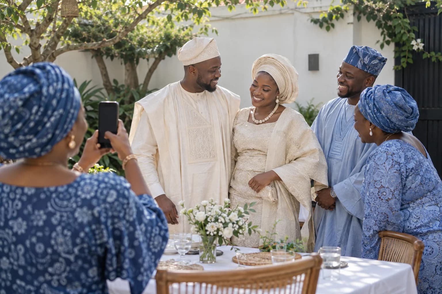 A couple celebrating a Nigerian wedding with their families