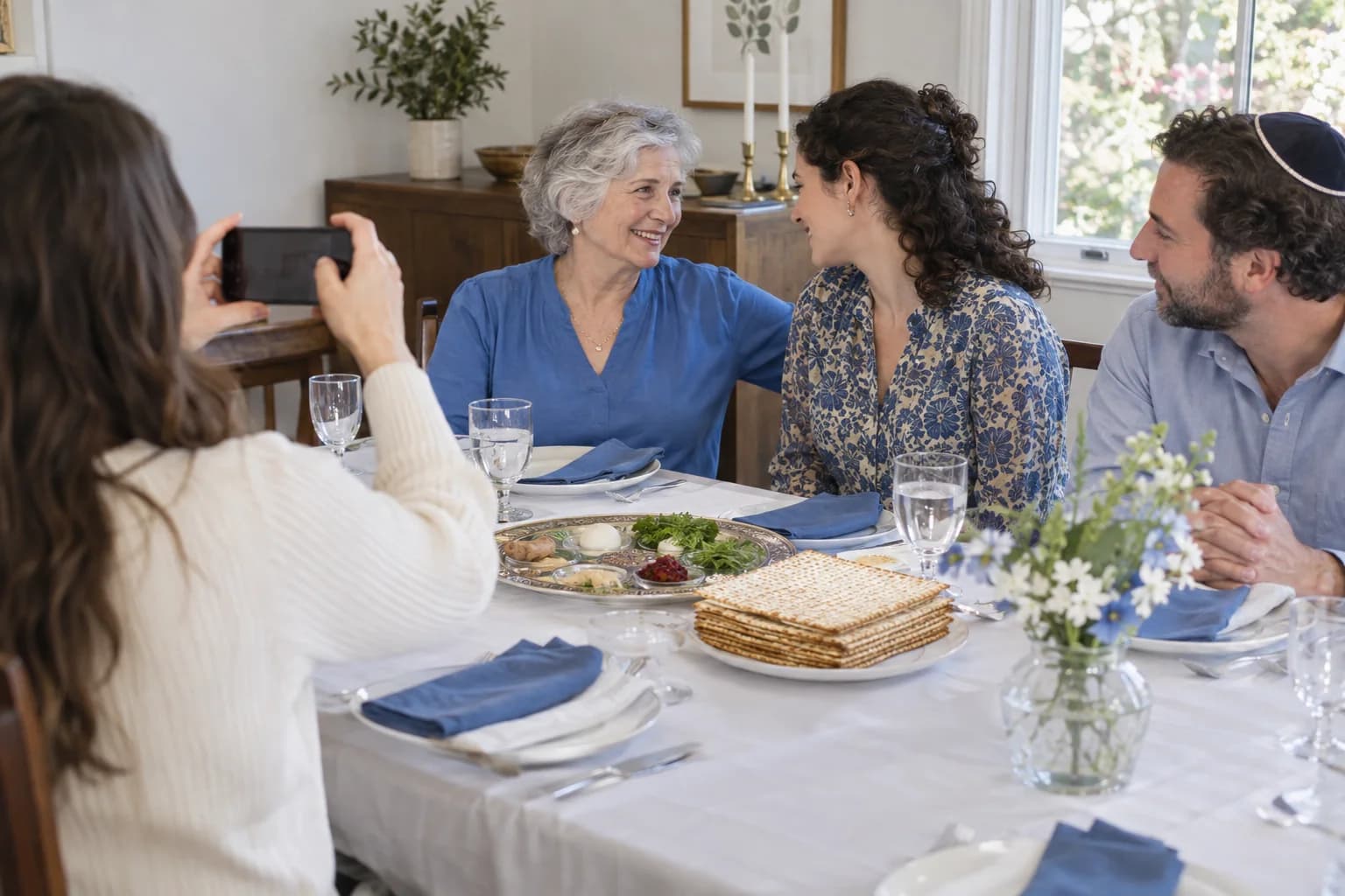 Family members gathered around a Passover Seder table