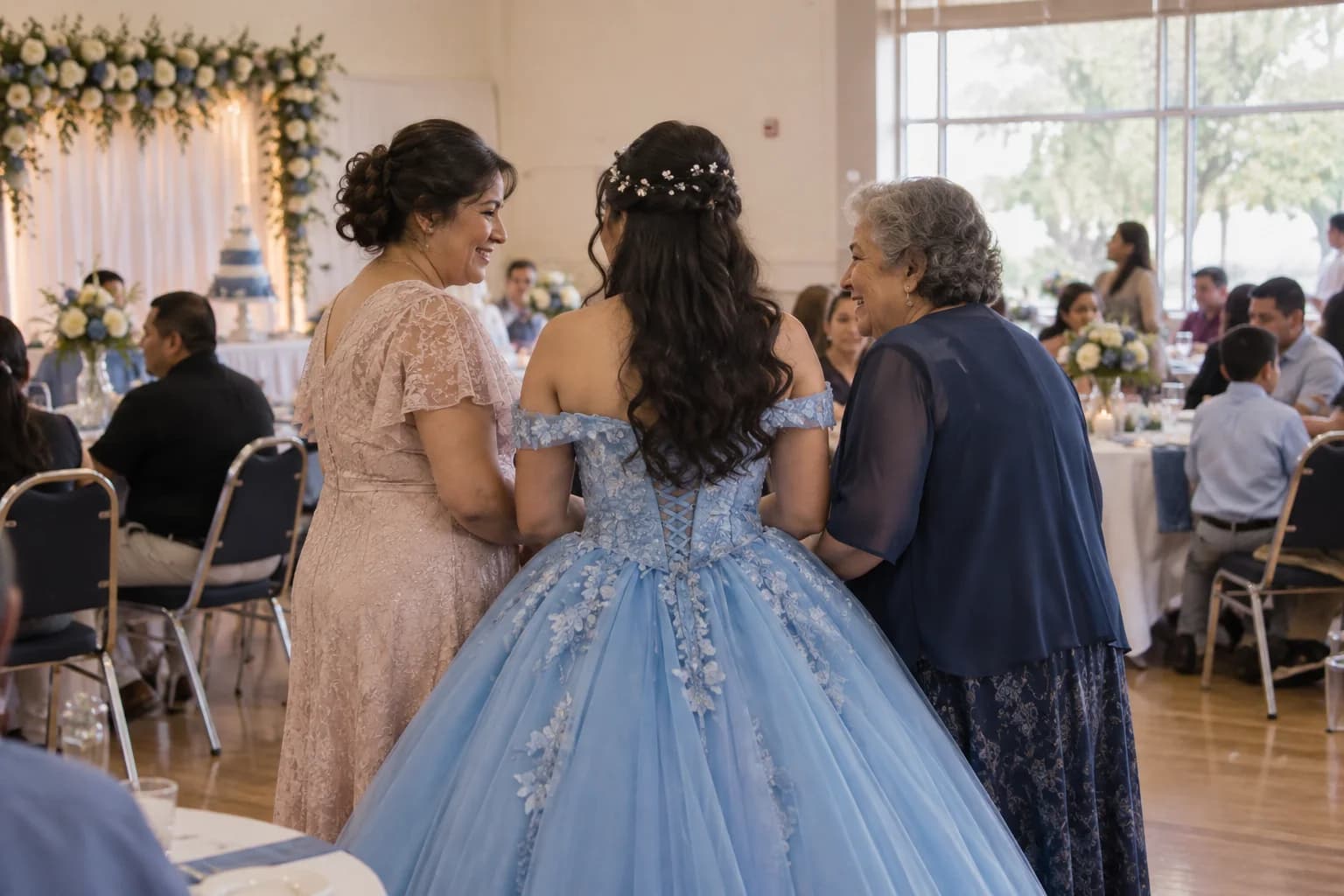 A young woman celebrating her quinceañera with family and friends